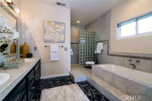 Master bathroom with separate tub and shower and double sinks