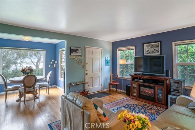 FRONT HOUSE: LIVING ROOM AND FORMAL DINING ROOM.