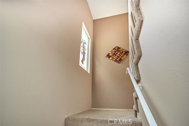 There is a beautiful stained glass window above the landing on the way upstairs.