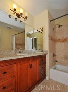 Bathroom with tub and shower between two upstairs bedrooms
