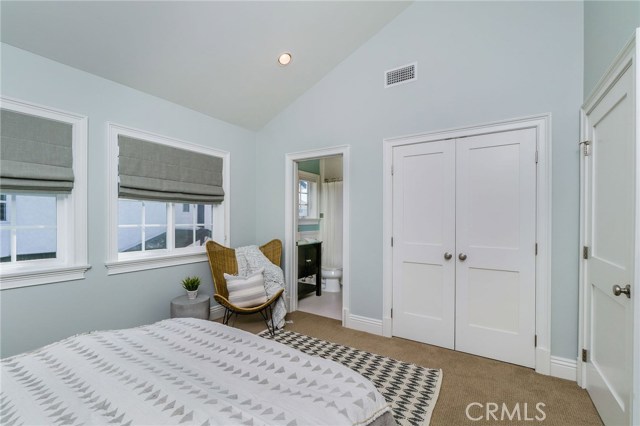 Bedroom one view of closet and bath entry.