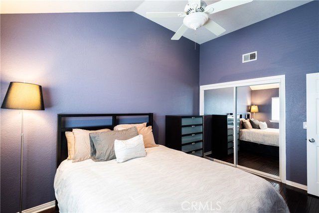 Another bedroom filled with natural light, soaring ceilings and plenty of closet space