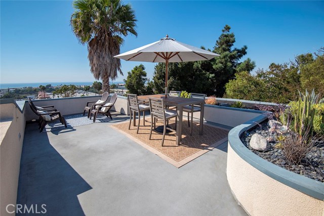 Spacious rooftop deck with room for dining and seating area