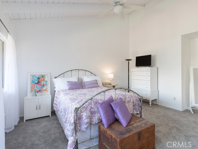 Master bedroom with cathedral ceilings and ceiling fan