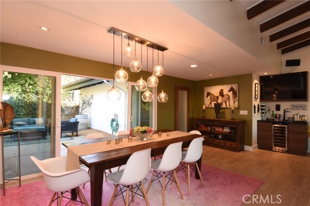 Gorgeous open dining room with patio beyond, and beautiful wine bar to the right!