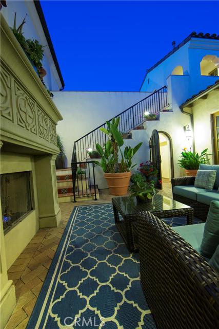 Beautiful private gated courtyard for entertaining, day or night! The stairs lead to your private guest suite/4th bedroom.