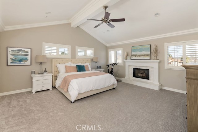 Master suite with marble tiled fireplace
