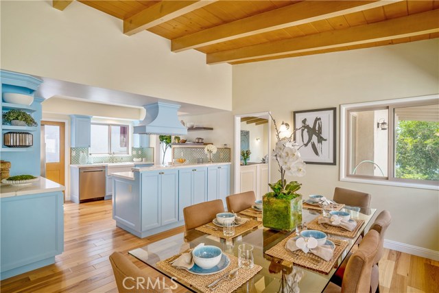 And from your dining room with additional seating area in addition to the dining room table.. you can see the chef cooking and go from one room to the next with ease. Open floor plan makes this beach home truly enjoyable. Add the ocean breeze and short few blocks to town. It's all here.