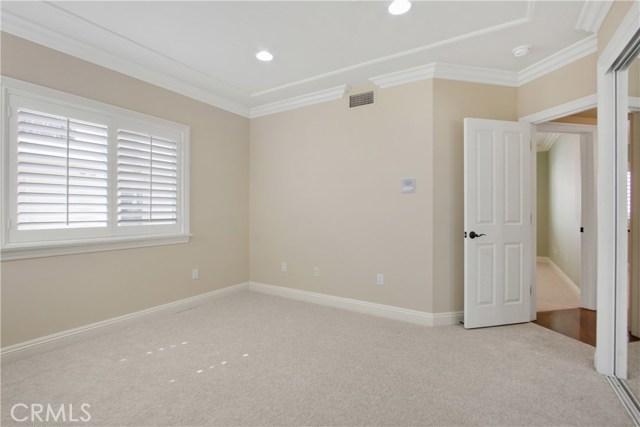 GOOD SIZED BEDROOMS WITH MIRRORED CLOSETS, PLANTATION SHUTTERS, CROWN MOLDING RECESSED LIGHTING , NEW PAINT & CARPETING