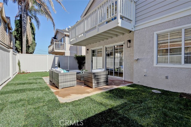 Backyard entry from living room and kitchen...gas hook up outside for barbecue