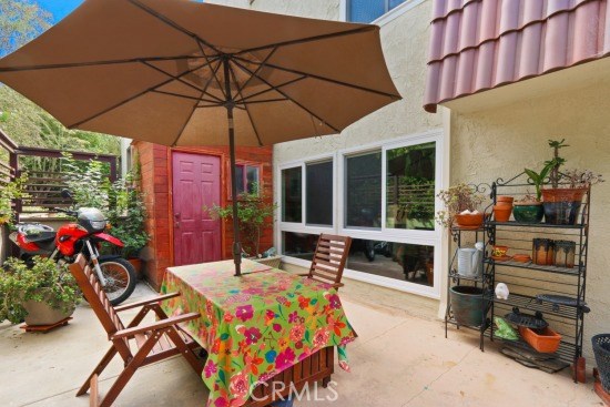 Private garden patio with storage shed
