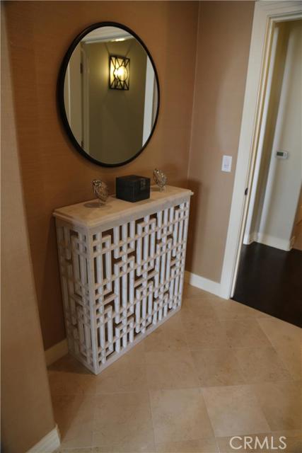 This beautiful custom console in the master suite entry was pieced together after being carved from a single slab of marble.