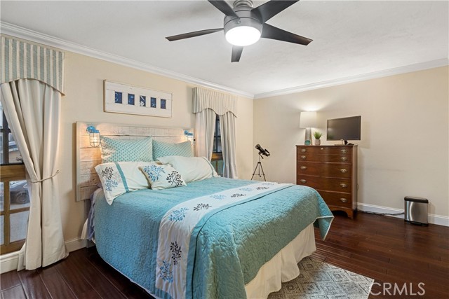 The second bedroom at the front of the home is spacious with hardwood floors and abundant closet space.