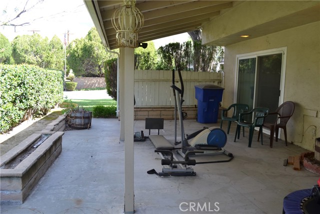 Backyard patio with view of sliders from dining area.