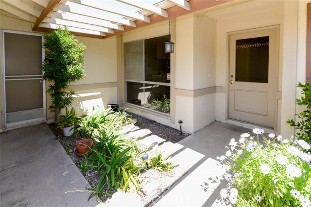 Front door entry.  Large window in kitchen dining area allows view to outside.