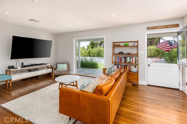 Dutch doors, french doors, and gleaming hardwood floors for sunny and bright living.