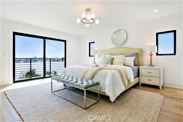 The Spacious and Bright Master Bedroom will accommodate a large Bedroom Suite.  The Sliding Glass Door opens to a Balcony with Ocean and Palos Verdes Views.