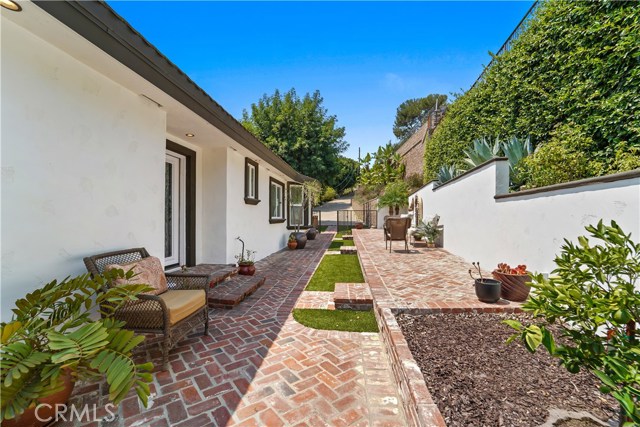One of two entrances with beautiful side yard.