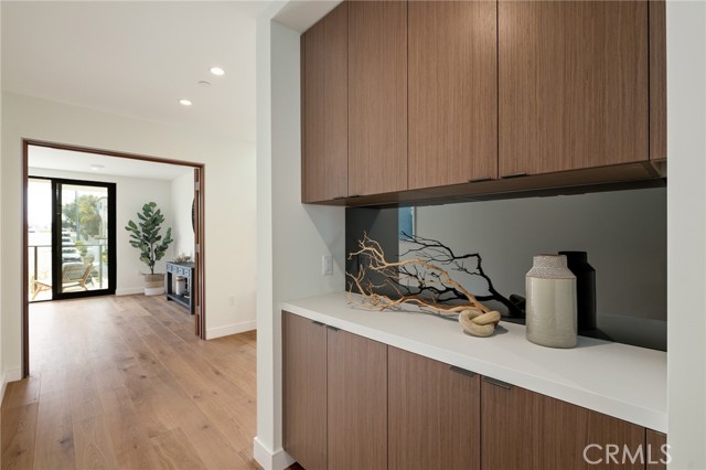 Custom built-ins in hallway ideal for both linen storage and personal display