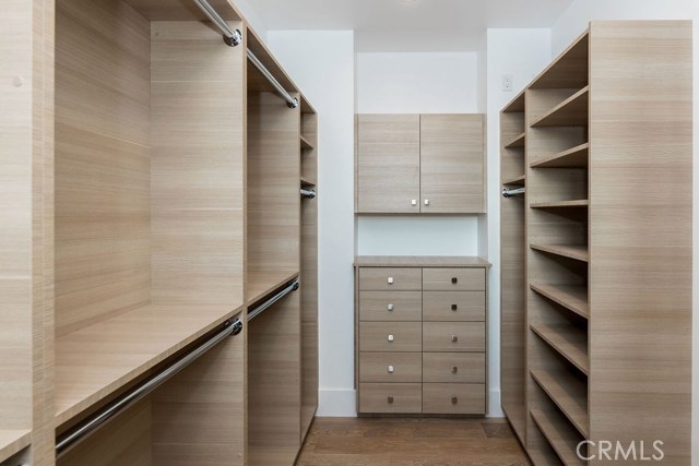 Stylish storage solutions in the master walk in closet