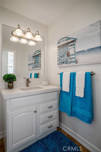 Updated Powder Bath with Calacatta Ravenna Quartz countertop.
