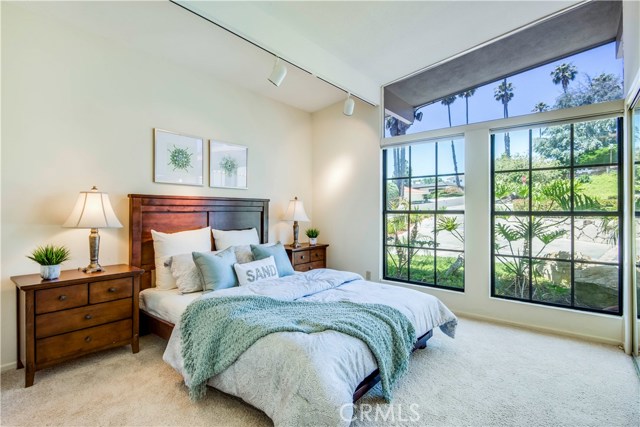 Sun filled 3rd bedroom with vaulted floor to ceiling windiows
