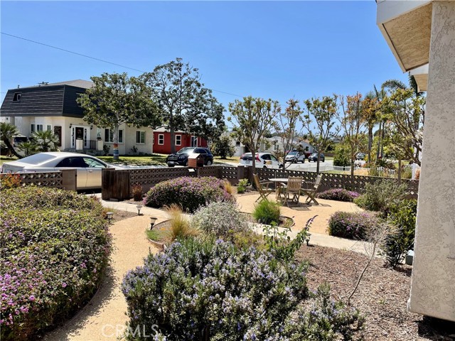 The front yard is complete with paths, landscape, al fresco area and more.