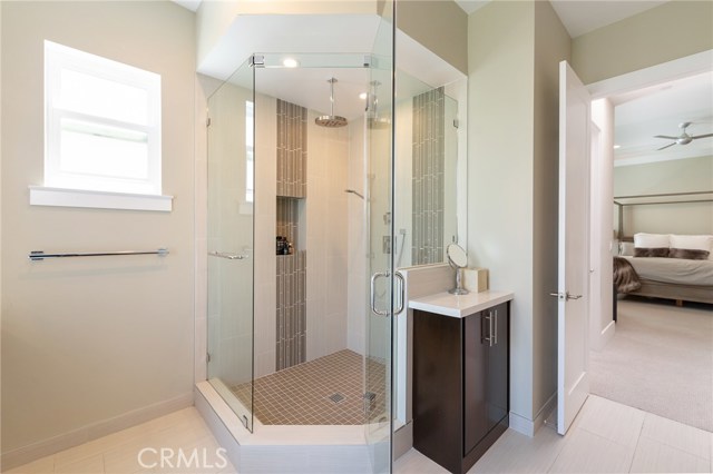 Rainfall shower and custom cabinetry