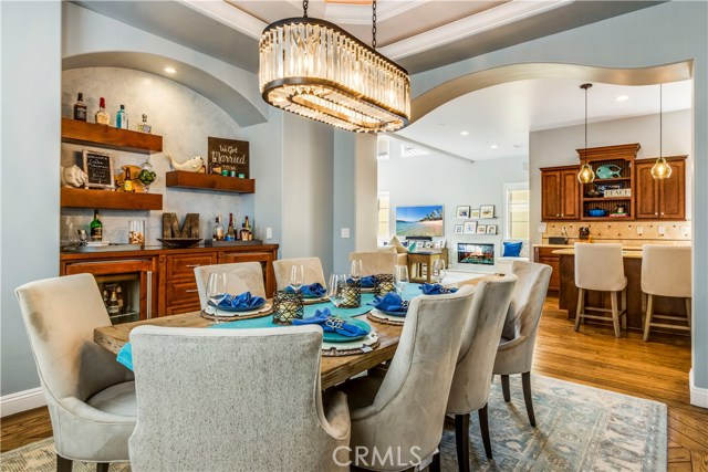 Another vantage point of formal dining room, highlighting its proximity to kitchen and how it flows into living area