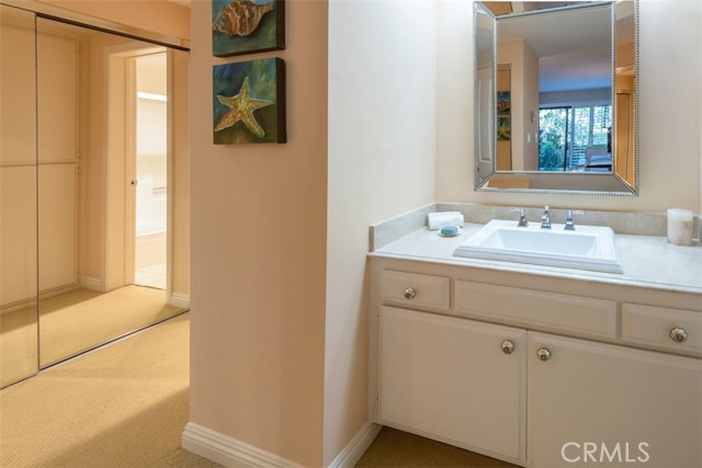 Master dressing area, mirrored wardrobes.