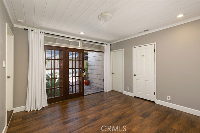 Guest Bedroom #2 with spacious cedar closet and direct access to backyard through solid wood, glass paned sliding door. This room could be used as a bedroom or office.