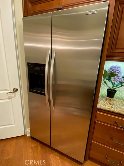 Stainless Side-By-Side Refrigerator with Water Dispenser/Ice Maker.