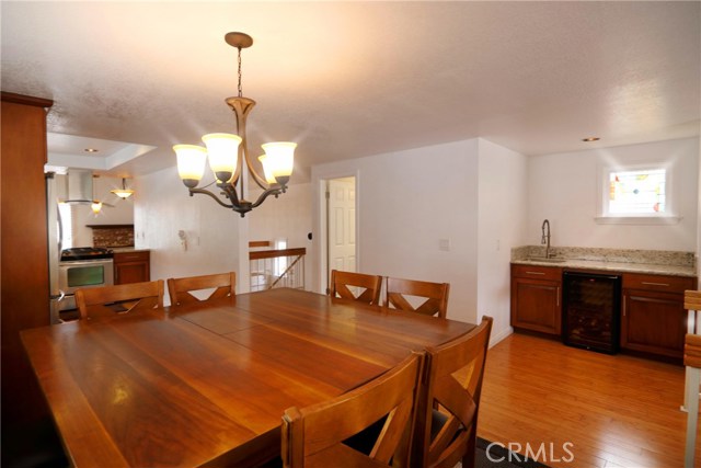 Enjoy entertaining in this large dining area with extra counter space at the wet bar for buffet style serving.