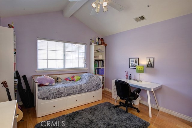 Bedroom 1 of 4, vaulted ceiling, ceiling fan and hard wood floor