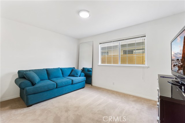 2nd bedroom with a giant closet that wraps around under the stairs