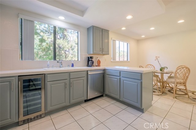 Great window over sink; Wine/Beverage Fridge, Dishwasher; Bar Counter to eating area/family room; recessed lights throughout