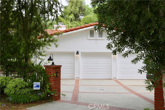 Finished 3 car garage with plenty of room for storage.  The gated driveway offers automatic gates and parking for up to 7 vehicles (or your Sprinter, Boat, or weekend driver).