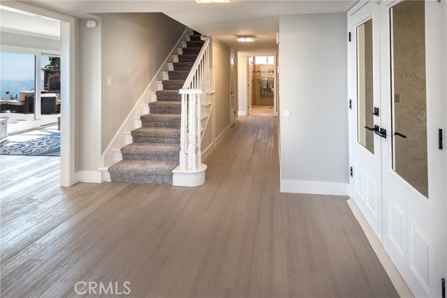 Hallway to main floor bedroom and bathroom