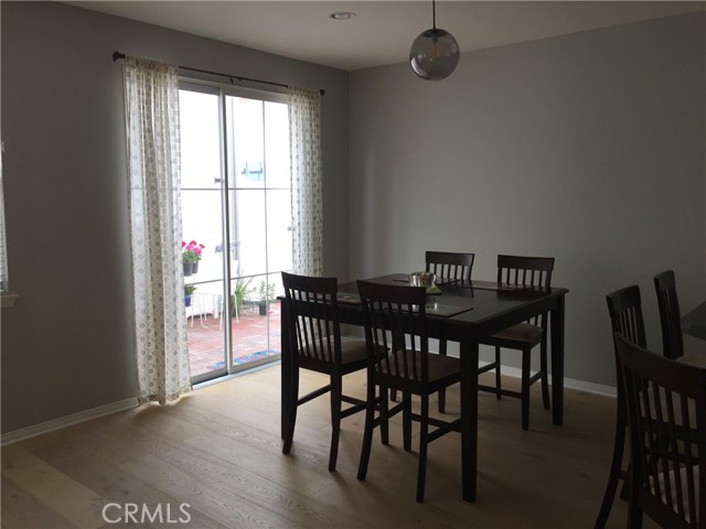 Dining area opens to the large patio for coffee, meals or play.