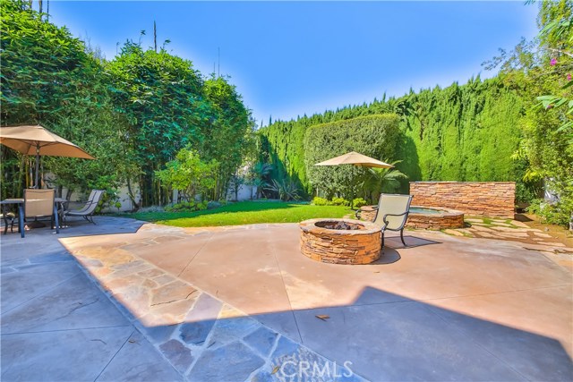 fire pit, spa and with mature landscaping throughout