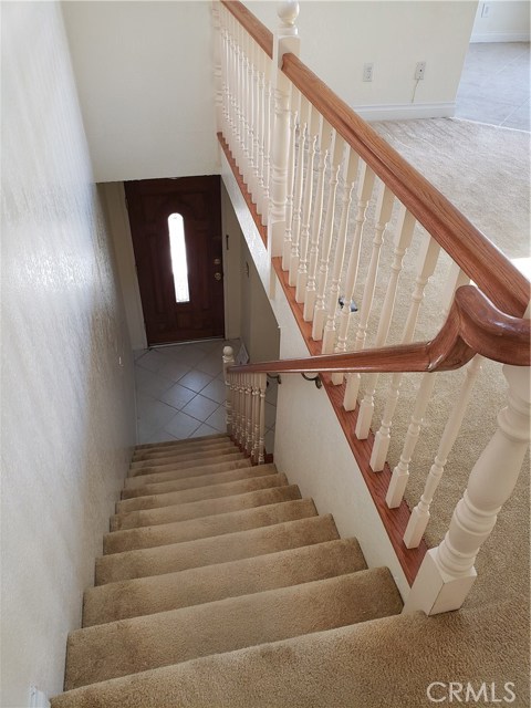 Stairway to Bonus Room, Laundry, and Garage.