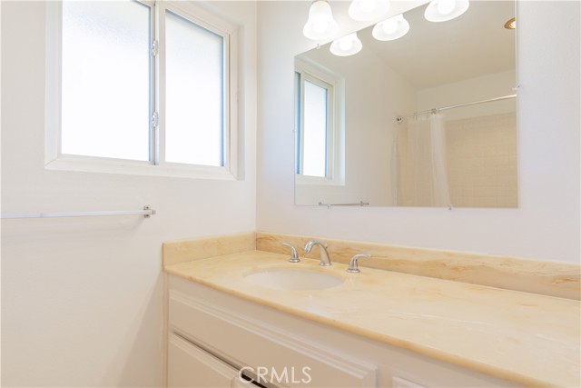 Upstairs bathroom with new fixtures, lighting, and mirrors