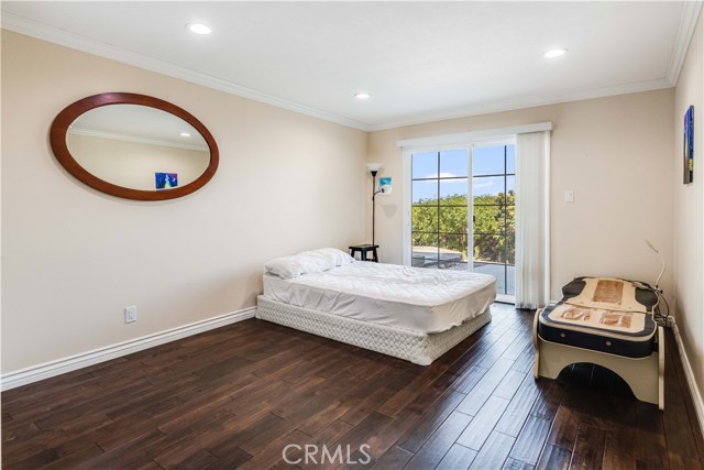 5th bedroom with sliding glass door to the backyard.