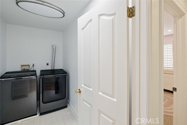 Laundry room conveniently located next to bedrooms