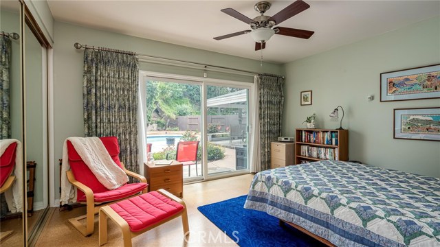 Downstairs master bedroom is used for many purposes for this family.  Currently used as a guest room--that's a Murphy bed!