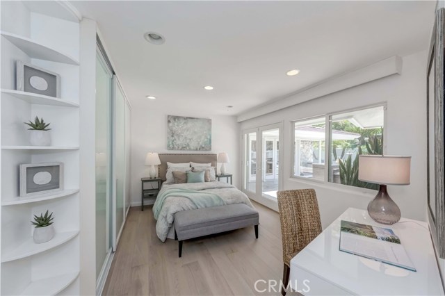 Bedroom #3: French-door to backyard patio, built-in shelves inside the sliding door closet, hanging-in closet