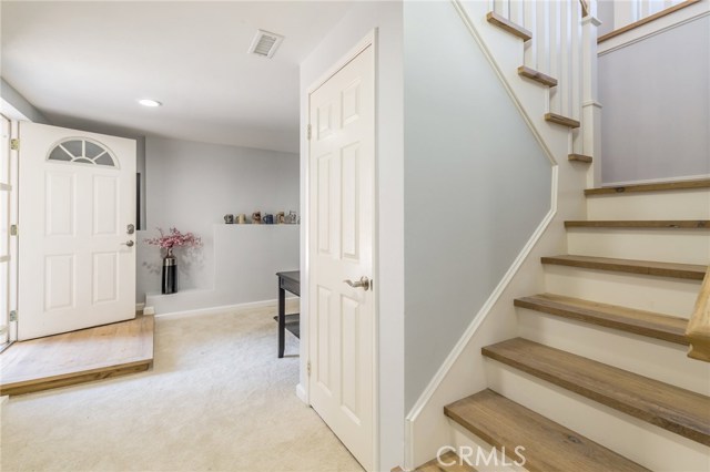 stairs leading to downstairs bedroom & office area that can be accessed from the exterior too