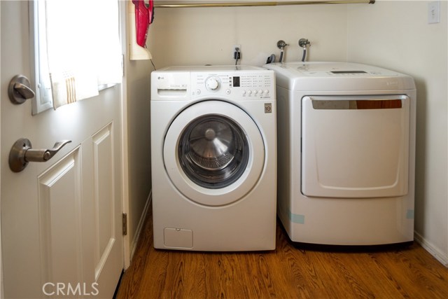 From the kitchen there is a hallway with outside access, laundry, a closet, and then the half bath