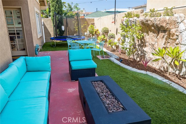 Plenty of room with outdoor furniture and a trampoline!