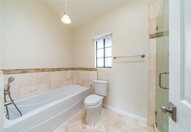 Large master bathtub to relax in.